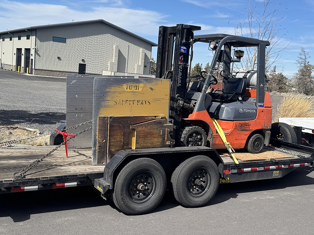 5-star service: a tractor tied down and ready for delivery